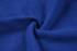 A close-up of a rich blue polar fleece fabric, showcasing its soft texture and smooth surface.
