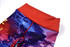 Tight leggings with a vibrant red waistband and a multicoloured abstract design in shades of purple and blue.