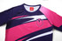 A pink and navy long-sleeve bathing suit featuring a logo, with a stylish wave design and contrasting colours.