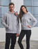 A grey full-zip fleecy hoodie is worn by a man and a woman, both posed together. The hoodie features a logo.