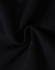 A close-up of black fleecy fabric, showcasing the soft texture and swirl pattern.