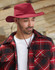 A maroon slouch hat featuring a break-away clip, paired with a red and black plaid jacket.