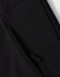 A close-up of a black softshell hoodie with a zippered side pocket and a logo.