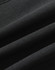 A close-up of a black softshell fabric with a smooth texture, featuring folds and creases.