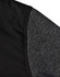 A close-up of a men's jacket featuring a quilted black body and grey heather sleeves, with a logo visible.