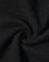 A close-up of black jacquard fleece fabric, showcasing its soft and textured surface.