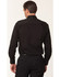 A black long sleeve military shirt featuring a button-up design and epaulettes on the shoulders.