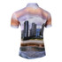 A short-sleeved polo shirt featuring a sunset beach scene with a skyline design, primarily in shades of brown and blue.