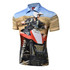 A short-sleeved polo shirt featuring a vibrant design of a man riding an ATV in a sandy landscape. It has a logo.