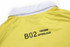 A yellow polo shirt featuring a white collar and a logo on the back, made from interlock fabric.