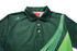 A green polo shirt featuring a curved green design and a logo on the chest. It has a classic collar and buttons.