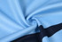 A light blue fabric with a smooth texture, featuring a dark navy horizontal stripe. The material appears breathable.