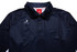 A navy blue polo shirt with a collar, featuring a logo and buttons at the front.