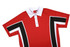 A red polo shirt featuring white and black stripes, with a collar and buttoned placket, includes a logo.