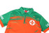 A quarter zip uniform top featuring orange and green colours with a logo and branding.