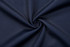 A navy fabric featuring a smooth, textured surface, ideal for a collared polo shirt design.