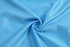 A light blue textured fabric in a swirling pattern, featuring a breathable mesh design.