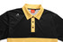 A black and yellow polo shirt with a collar, featuring buttons and a logo on the side.