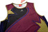 A maroon and navy singlet featuring a bold design with star patterns and a logo.
