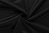 A black fabric with a smooth texture, elegantly arranged in a spiral pattern.