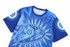 A blue Aboriginal cotton t-shirt featuring intricate geometric patterns and a logo.