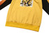 A yellow esport club jersey featuring a graphic design on the front and black and orange sleeves. It has a front pocket.
