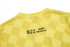 A yellow checkered shirt featuring a logo and text on the back. The fabric appears lightweight and textured.