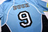 A blue soccer polo with black and white accents, featuring the name "BUCK" and the number 9 on the back.