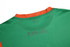 A green custom made T-shirt featuring an orange collar and a branding logo on the back.