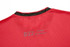 A red custom sportswear t-shirt featuring a textured pattern and a small logo at the back.