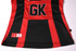 A netball polo in red and black with a logo and a "GK" label.