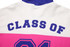 A cotton hoodie featuring a white, pink, and purple design with "CLASS OF" printed on the back and a logo.