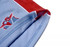 Cotton school shorts in light blue with a red trim, featuring a logo on the side.