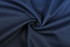 A close-up of dark navy fabric, featuring a smooth and textured weave, suitable for sportswear.