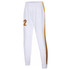 White women's cricket uniform pants with gold stripes and a logo. Features elastic waistband and zippered ankles.