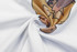 A close-up of a white cotton t-shirt featuring a colourful vinyl print design.