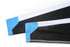 A sports uniform featuring black fabric with blue and white accents on the sleeves, including a logo detail.
