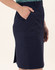 A navy utility cargo skirt with side pockets and a side slit. The fabric is smooth and structured.