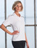 A white ladies' polo shirt with black side detailing and a branding logo.