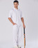 Men's cricket pants in white, paired with a matching polo shirt and holding a cricket bat. Features a logo.