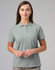 A light grey ladies cotton stretch polo shirt with a classic collar and three-button placket. Features a logo.