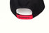 A black cap with a red adjustable strap featuring a logo on the back.