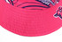 A reversible bucket hat in vibrant pink with a patterned interior and a logo on the brim.