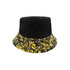 A reversible black and yellow bucket hat featuring a wavy pattern on the brim and a solid black top.