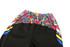WARM UP PANTS in black with a colourful graphic pattern on the waistband and side panels, featuring a logo.