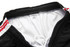 Black training pants with a white inner lining and red accents, featuring an elastic waistband and drawstring.