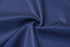 A fabric swatch featuring smooth, deep navy blue material, with a slight sheen. Includes a logo detail.