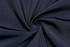 A dark navy fabric with a smooth texture, arranged in a spiral pattern, showcasing its soft feel.