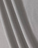 A textured fabric in light grey, showcasing a breathable mesh design suitable for polo shirts.