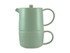 A green tea pot and cup set, stacked together, featuring a smooth finish and a minimalist design.
